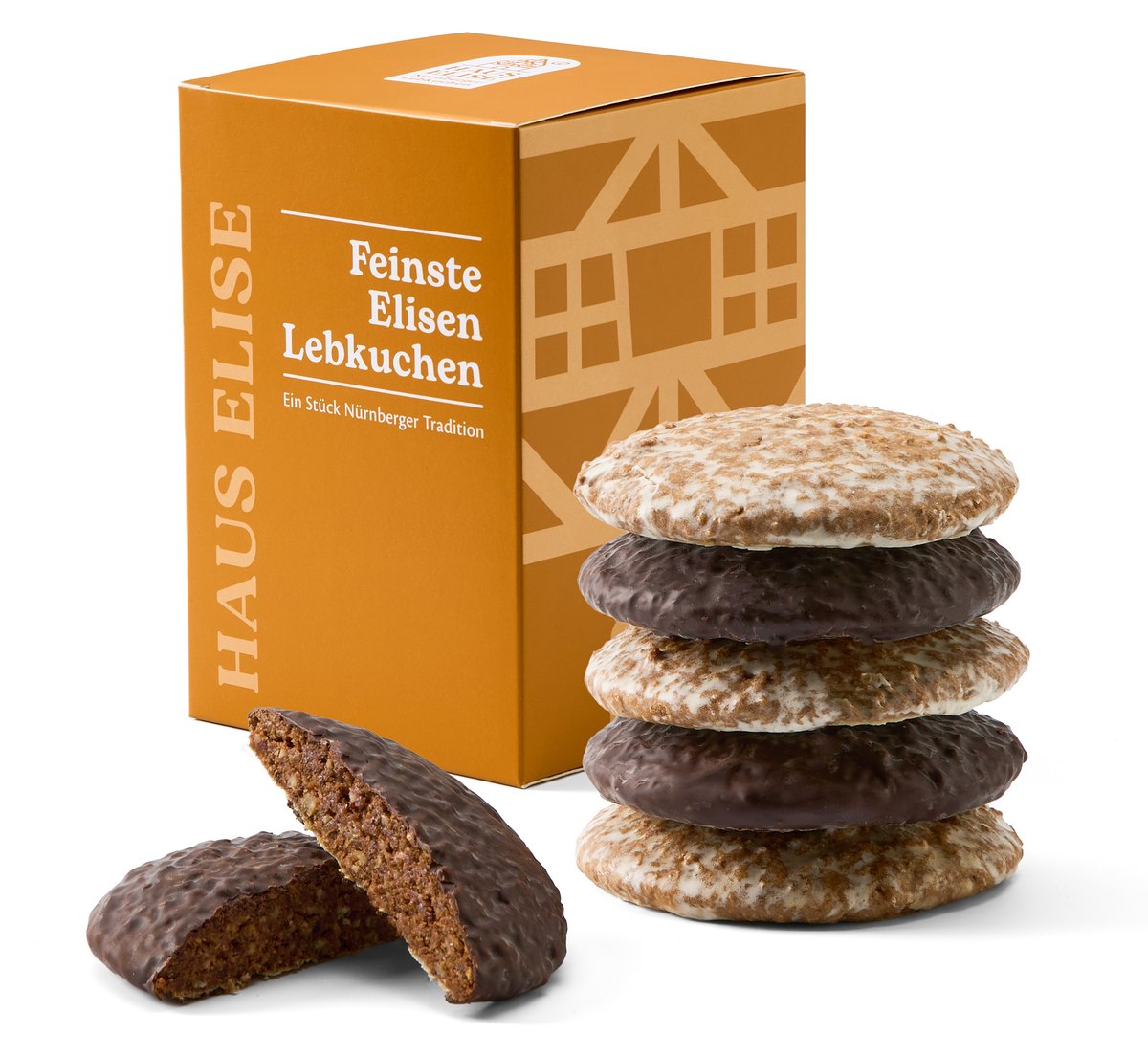 HAUS ELISE Elisen-Lebkuchen 6er Box mit Fachwerk-Motiv, daneben ein Stapel gemischter Lebkuchen und ein angeschnittener Schokolebkuchen